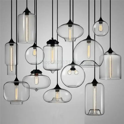 Clear glass pendant lights with black metal fixtures and exposed filament bulbs for decorbites colorful stained glass decor
