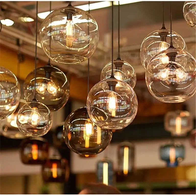 Clear glass globe pendant lights with visible filament bulbs for modern decorbites colorful stained glass kitchen decor