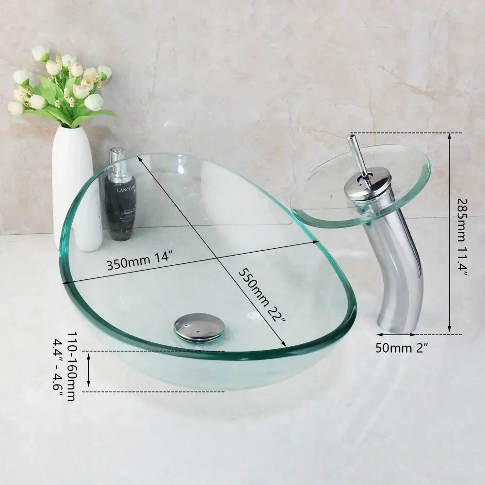 Clear glass vessel sink with sleek modern design and chrome basin mixer faucet for bathroom use
