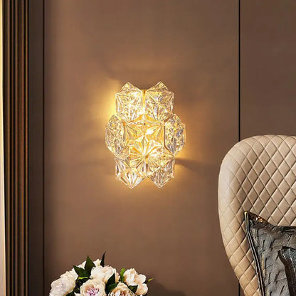Modern hexagon gold finish crystal wall light with faceted glass design emitting warm light for e12 e14 bulbs