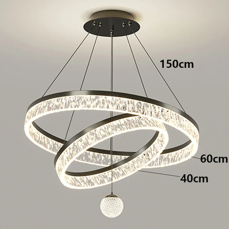 Modern black finished led chandelier with three interlocking crystal embedded rings and a spherical pendant for indoor lighting