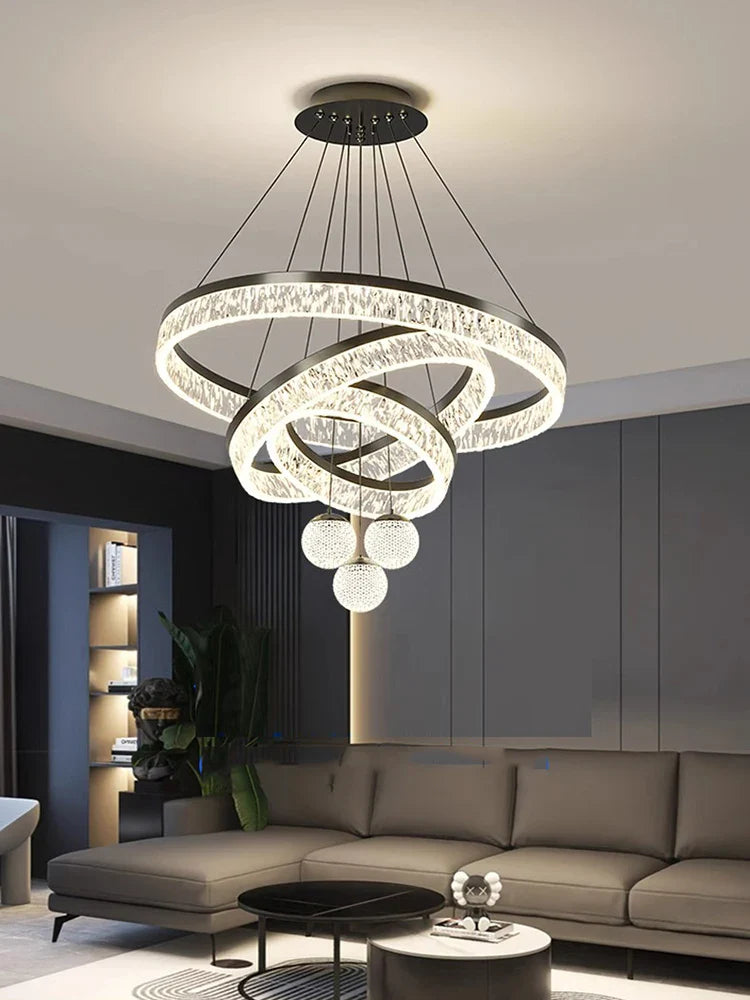 Modern home decor led spiral chandelier with glowing rings and spherical lights made of polished metal and crystal for living room