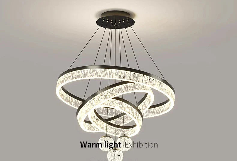 Modern black-framed chandelier with interlocking crystal rings and spherical LED lights for living and dining rooms