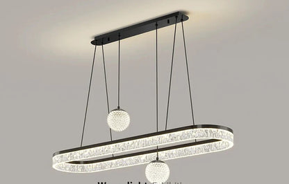 Modern black-framed oval pendant light with crystal rings and glass globes for living and dining room lighting