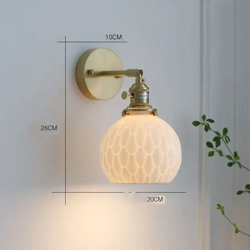 Vintage-style brass ceramic led wall sconce with frosted honeycomb glass globe for modern bedroom decorbites ceramic led wall