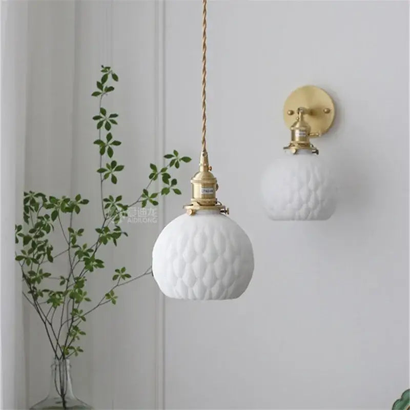 Modern honeycomb brass ceramic led wall sconce featuring white textured glass and gold-toned decorbites ceramic led hardware