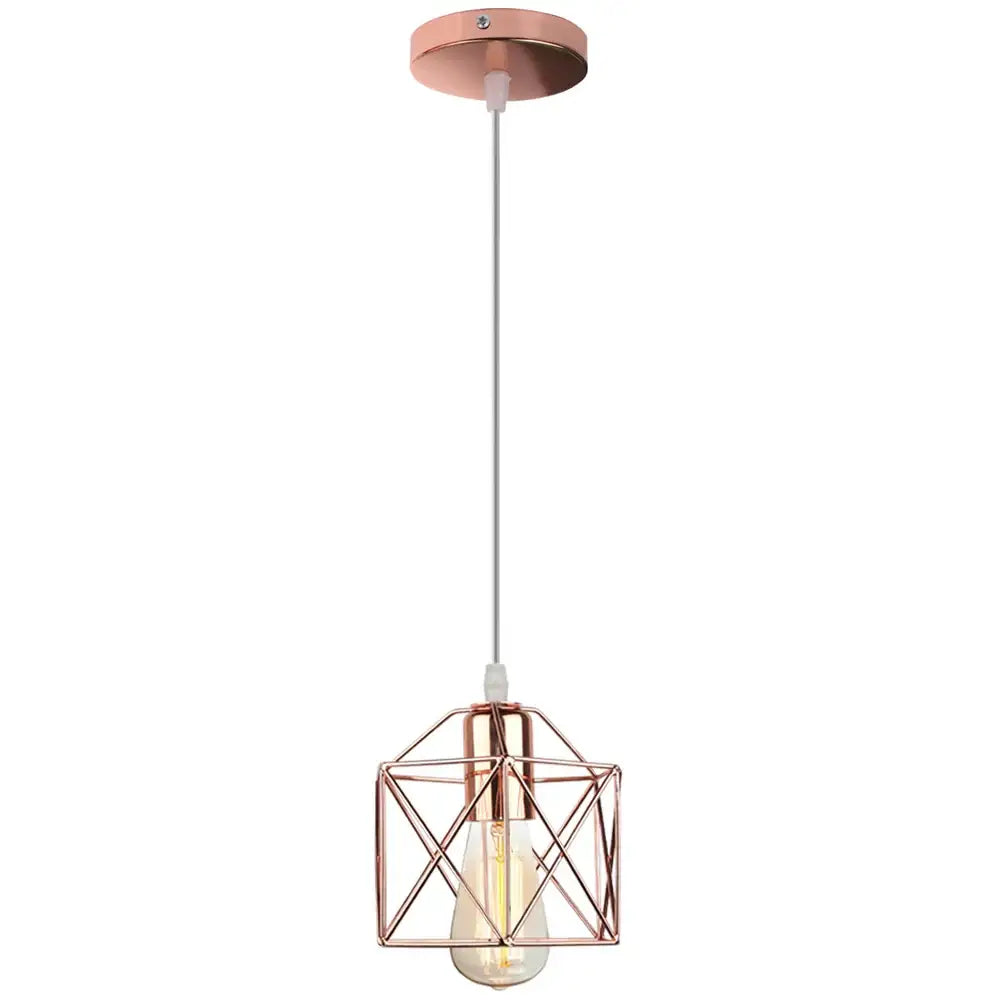 Rose gold geometric decorbites cage pendant light with visible filament bulb for modern industrial dining room decor