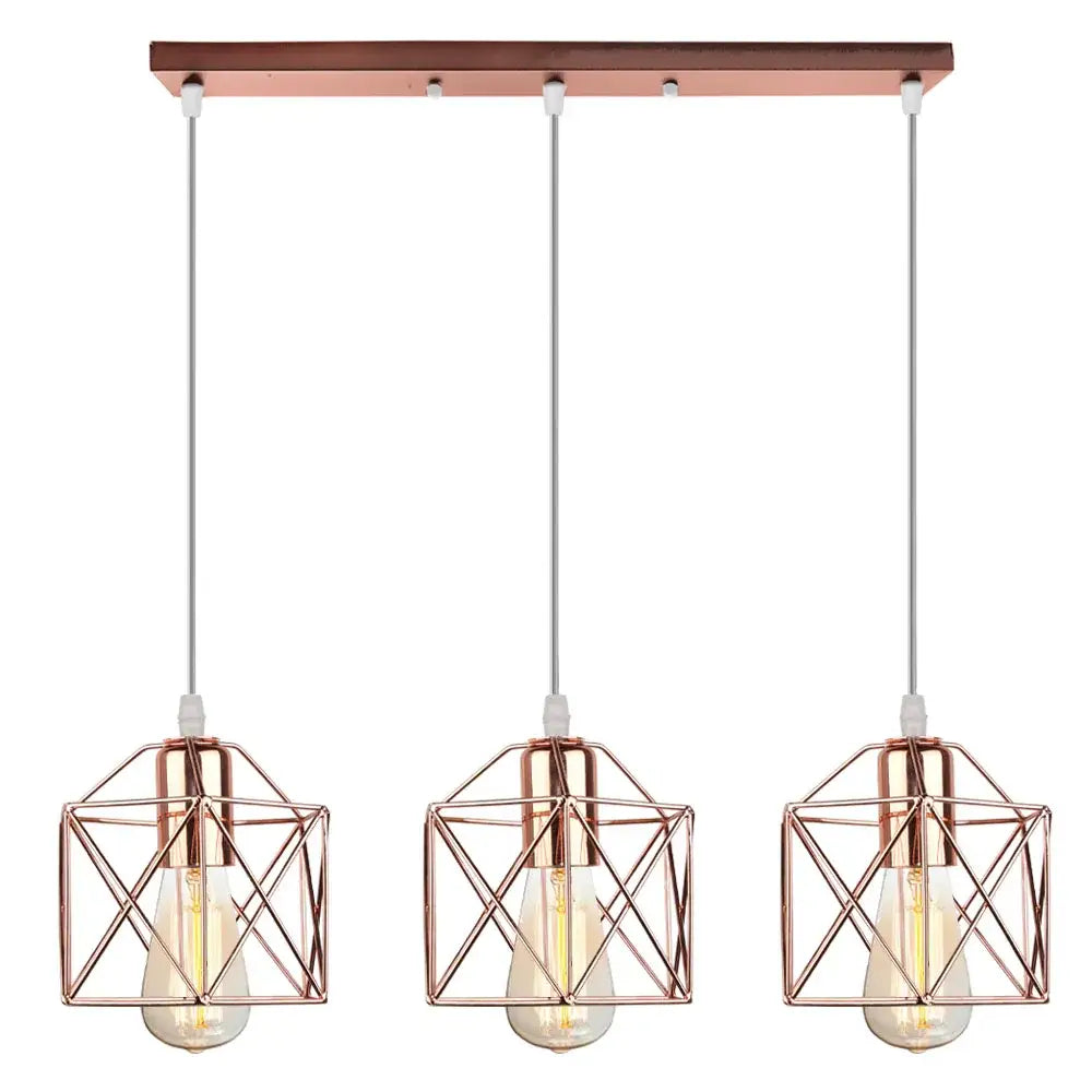 Three rose gold geometric wire cage pendant lights with exposed bulbs for modern industrial dining room decorbites cage pendant