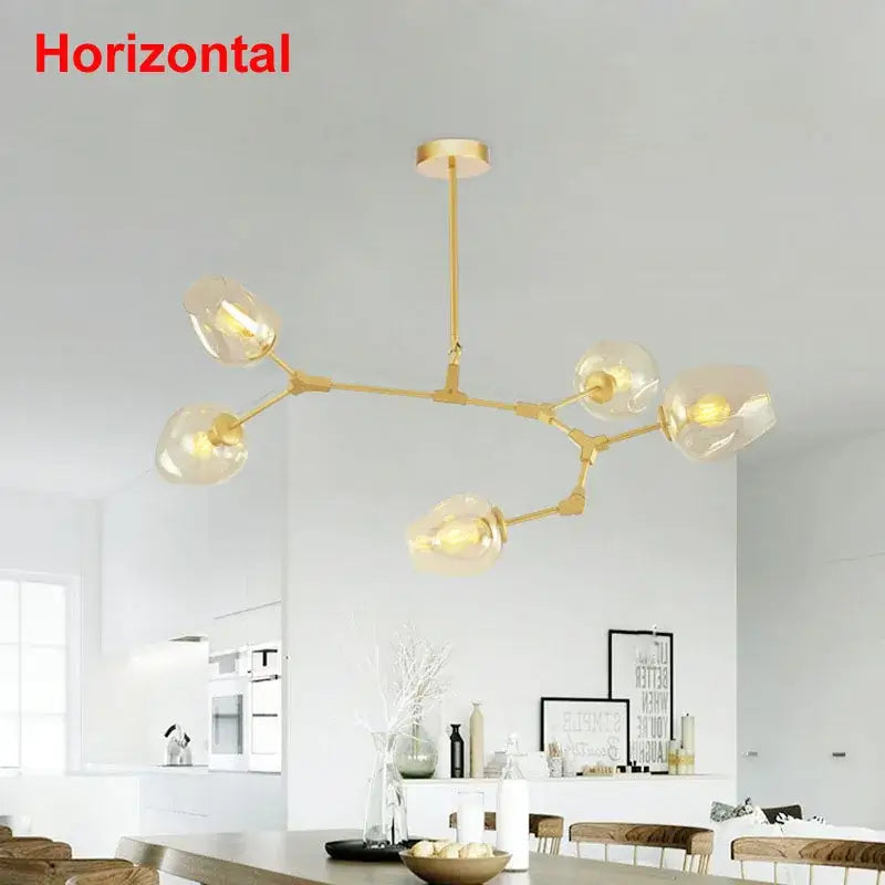Gold-toned decorbites industrial globe chandelier with six clear glass shades for modern dining room lighting