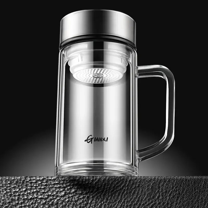 Modern insulated glass tea cup with silver lid handle and white mesh infuser for brewing loose leaf tea