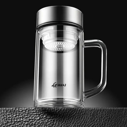 Modern insulated glass tea cup with silver lid handle and white mesh infuser for brewing loose leaf tea