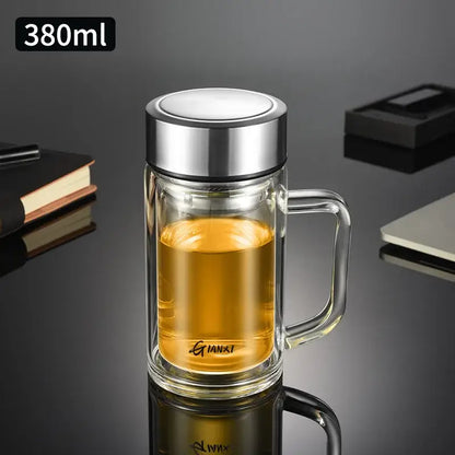 Modern insulated 380ml double-walled glass tea cup with stainless steel lid and handle filled with amber glass tea