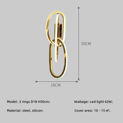 Modern interlocking oval gold wall sconce lighting fixture with three steel and silicone rings for bedroom decorbites gold led