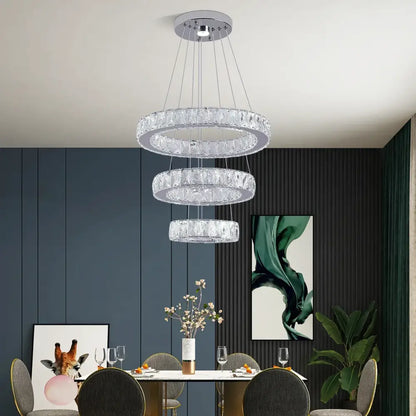 Modern three-tiered crystal led chandelier with sleek chrome finish for living room lighting and elegant design