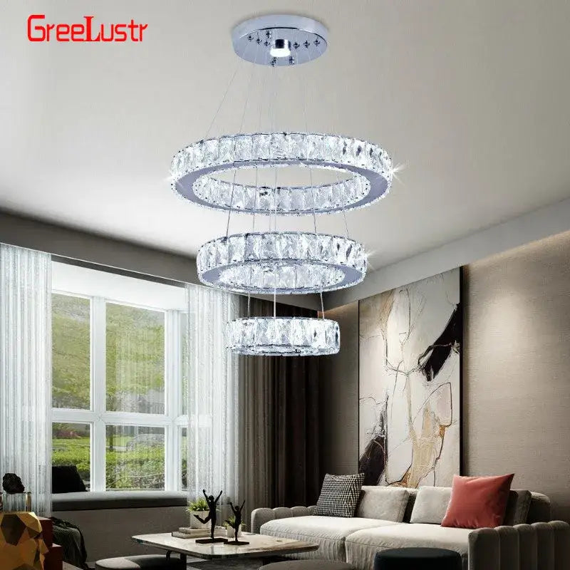 Modern three tiered crystal led chandelier with sleek chrome finish and cascading faceted clear crystals for living room light
