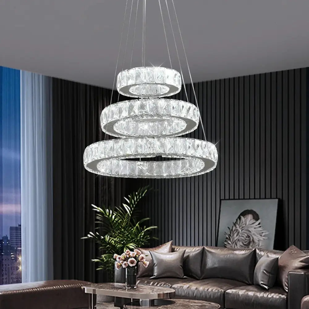 Modern interlocking ring crystal led chandelier with a sleek silver frame and cascading clear faceted crystals for living room lighting