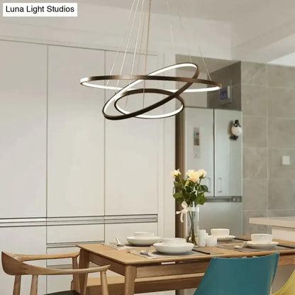 Modern black and white led pendant lights with interlocking circular rings for dining room modern pendant lighting