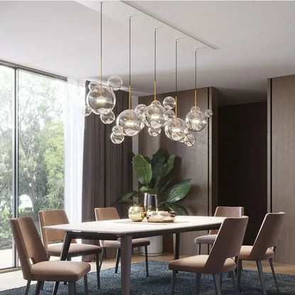 Modern iridescent colorful glass ball pendant light with gold-toned metal accents for dining room decorbites colorful glass