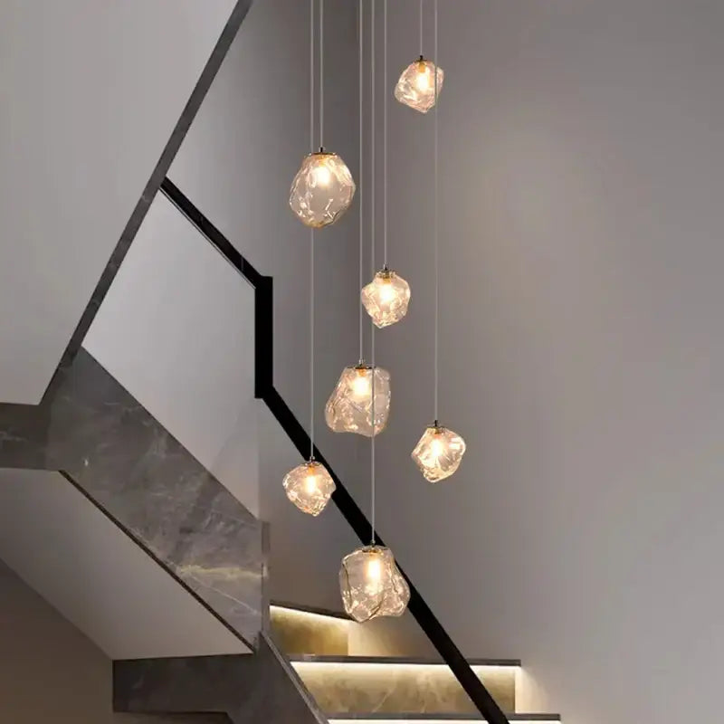 A modern iron and glass pendant light with six translucent irregular glass pendants as a dining room statement piece