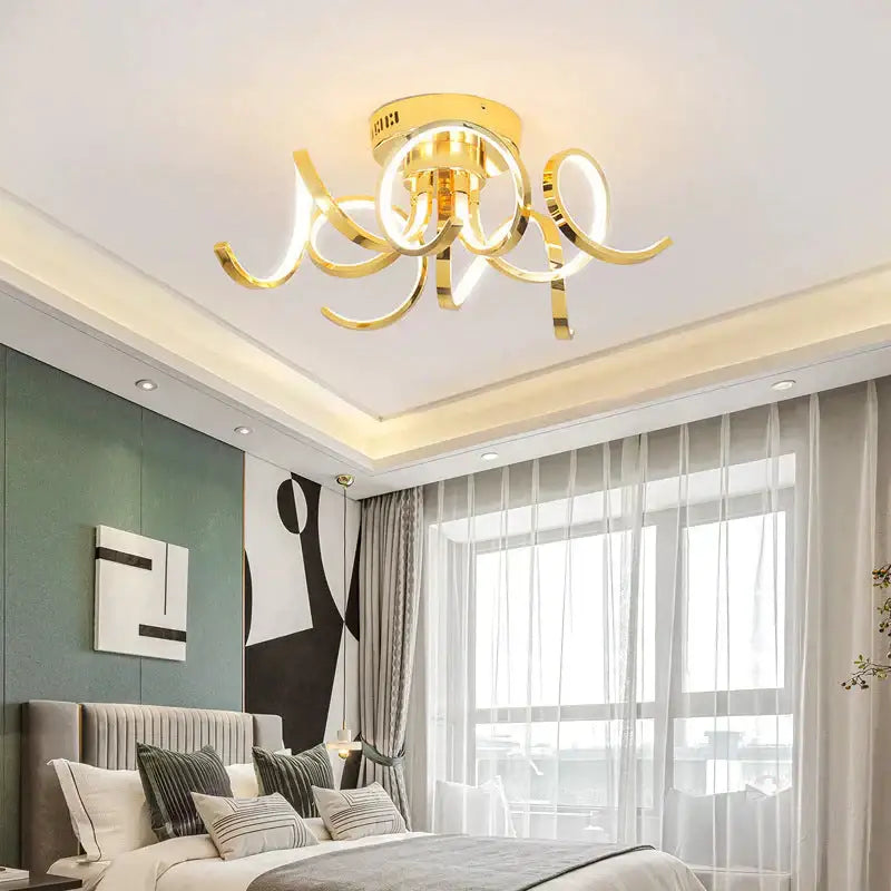Gold-colored led modern iron pendant light with curved swirling arms and circular aluminum acrylic fixture for foyer