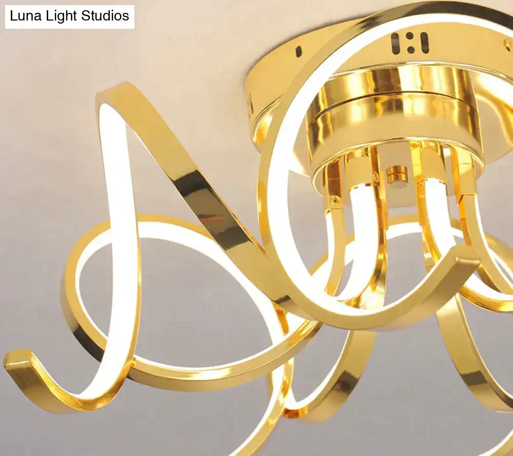 Gold-finished led modern iron pendant light with sleek intertwined circular rings for foyer and bedroom lighting