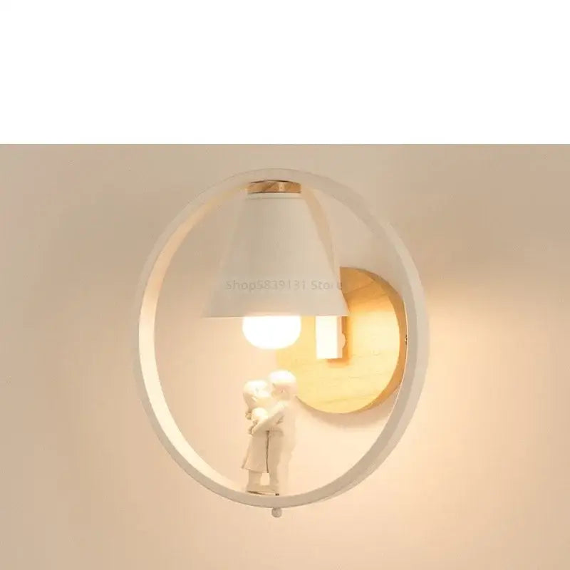 Modern iron led wall lamps featuring a white circular sconce with wooden backplate and child figurine decorbites iron led