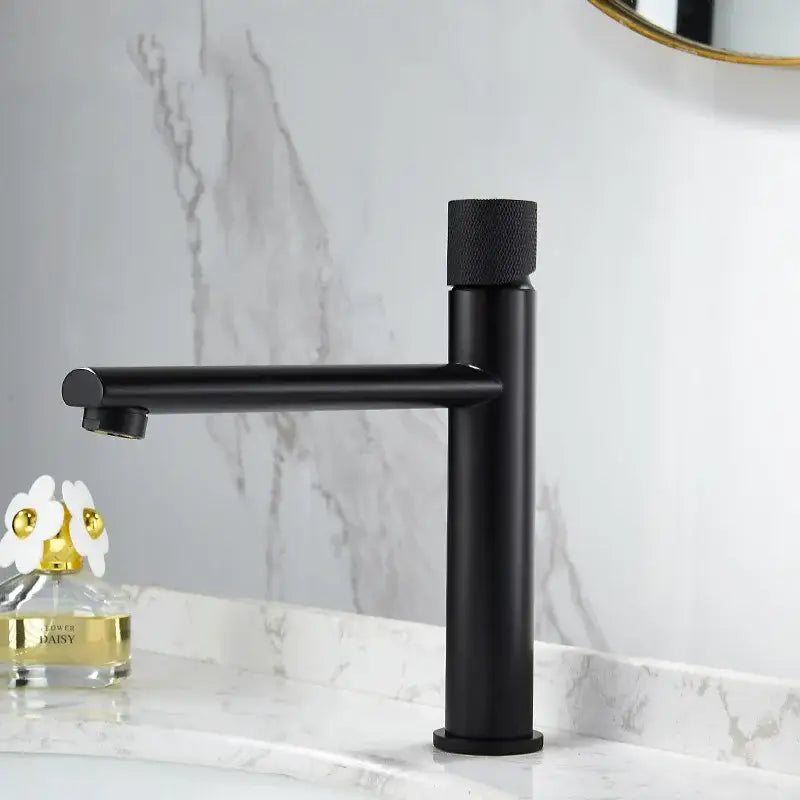 Modern knurled brushed gold basin faucet with black matte single-handle and textured cylindrical knob decorbites brushed gold