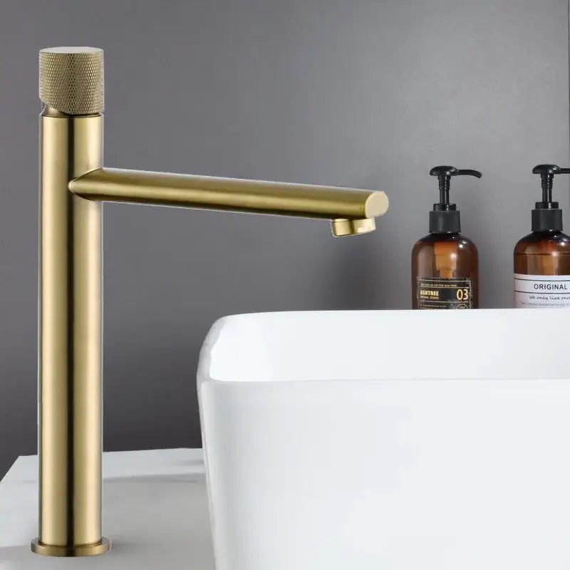 Modern brushed gold basin faucet with textured knurled handle and sleek cylindrical spout by decorbites brushed gold