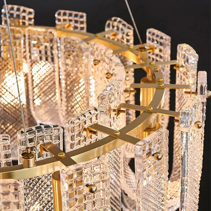 Modern layered clear glass and gold ceiling chandelier with faceted crystal panels and dimmable led copper accents