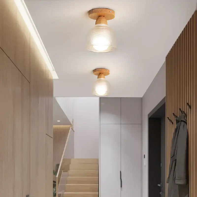 Two warm-toned modern leaf glass ceiling lights with wooden bases and clear glass LED shades for hallway decorbites decor