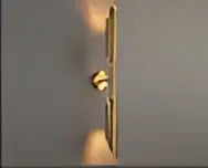 Gold led wall lamp with modern leaf design and gold chain featuring circular links for bedroom decorbites gold led decor
