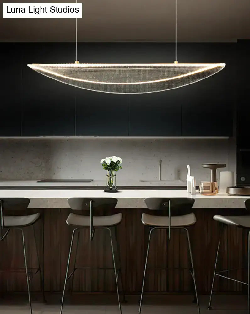 A modern leaf shaped acrylic led pendant light with gold mesh design for dining room illumination