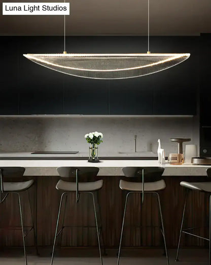 A modern leaf shaped acrylic led pendant light with gold mesh design for dining room illumination