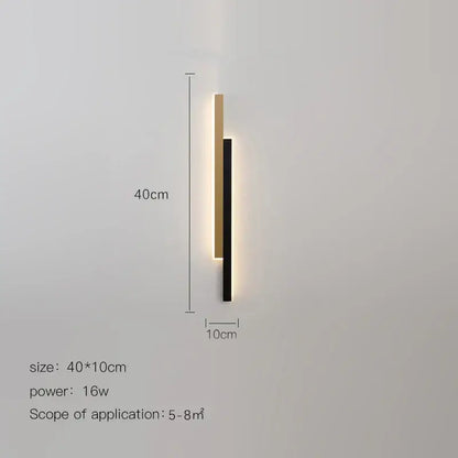 Modern led black wall lamp with two vertical bars in matte black and brushed gold emitting warm gold glow decorbites led black