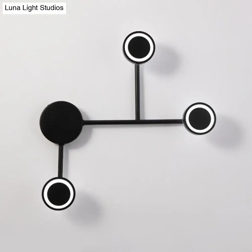 Modern led black wall sconce with circular warm white led fixtures and sleek metal arms for bedroom coat rack use