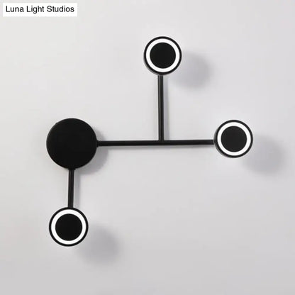 Modern led black wall sconce with circular warm white led fixtures and sleek metal arms for bedroom coat rack use