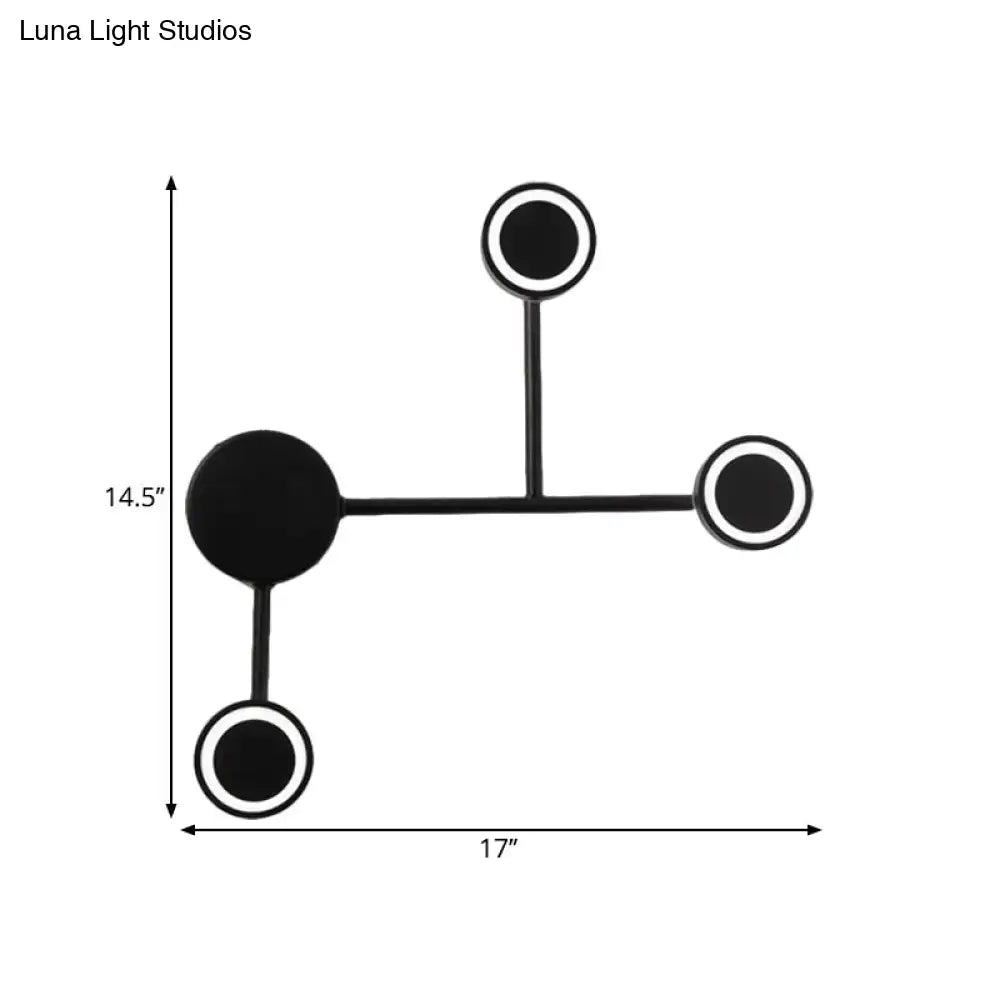 Modern led black wall sconce with circular design and warm white light featuring coat rack hooks for bedroom use