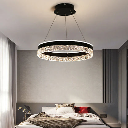 Modern led ring chandelier with black frame and sparkling crystal accents suspended by cords for living and dining rooms