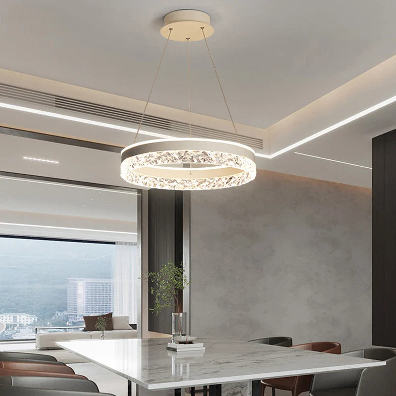 Modern LED chandelier pendant lamp with a white frame and sparkling crystal accents for living and dining rooms