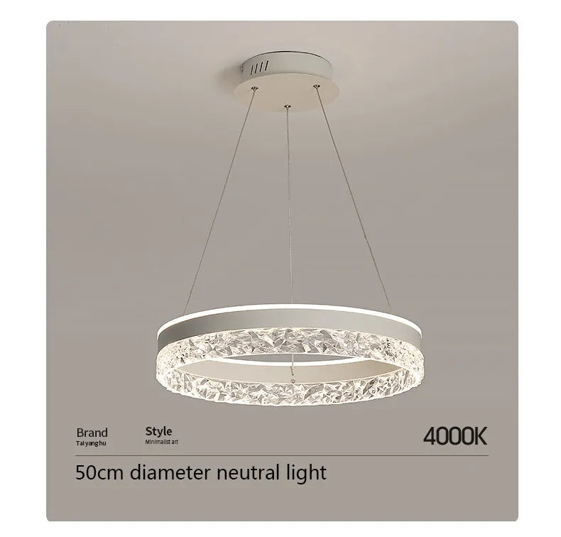 Modern led chandelier circular pendant lamp with white frame and clear crystal accents emitting bright neutral glow
