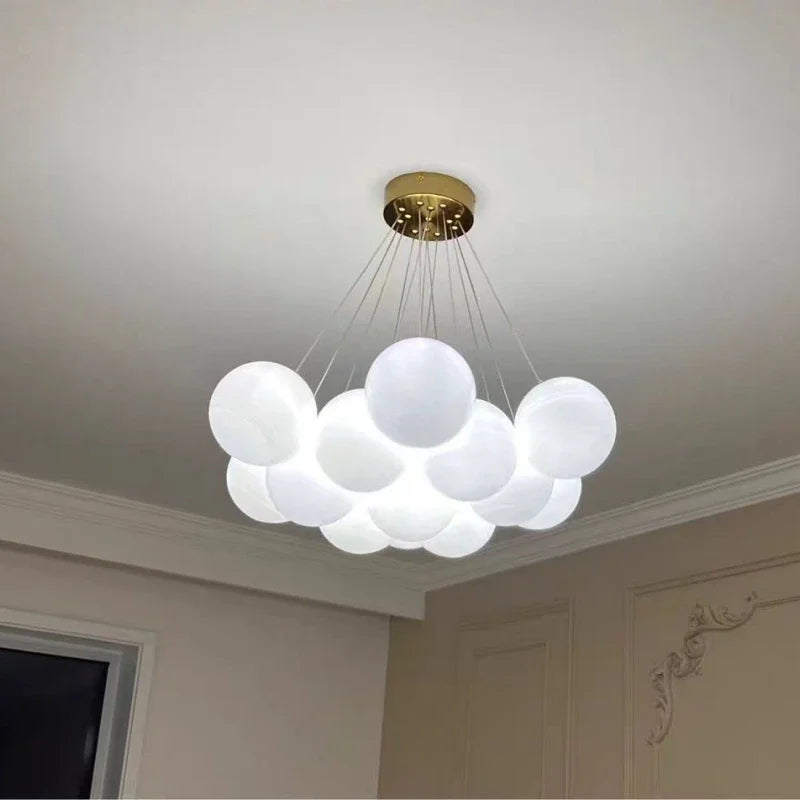 A modern cloud-shaped luxury led chandelier with frosted glass balls and gold mount for living room lighting decor switch type
