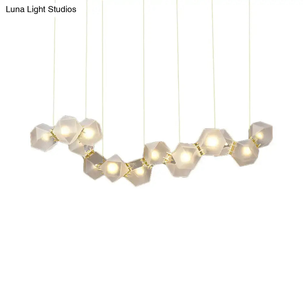 Modern geometric pendant ceiling light with white frosted glass hexagonal shades and gold connectors for dining room use
