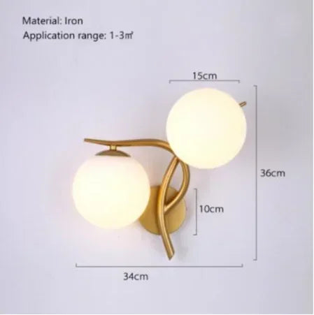 Gold-toned iron wall sconce with two frosted glass globe shades for modern led ceiling chandelier lighting decor