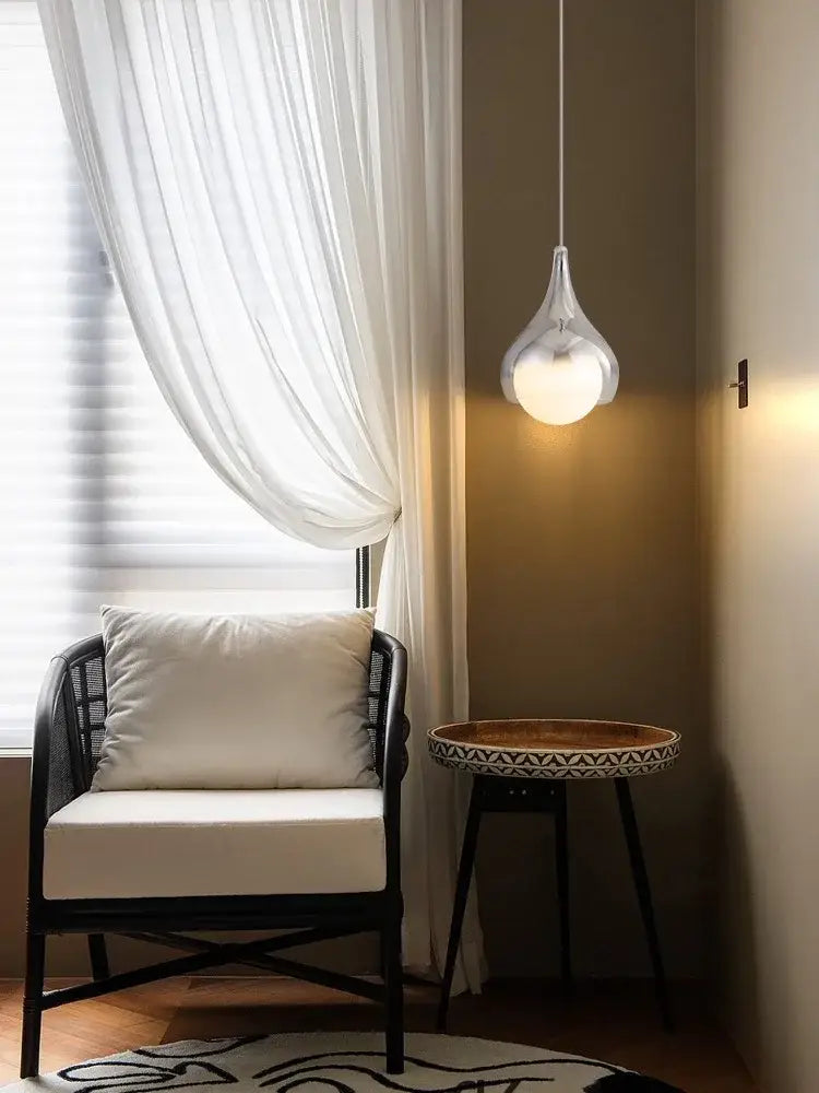 A modern led water droplet ceiling chandelier with frosted glass globe and metallic frame for bedroom decorbites led water