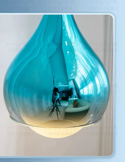 A sleek translucent blue glass led water droplet pendant light for dining room water droplet ceiling decorbites led water