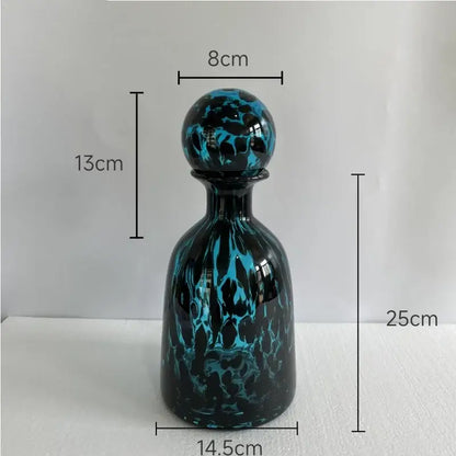 A sleek 25cm tall modern leopard texture glass decanter with black base and teal marbled pattern for dining room decorbites