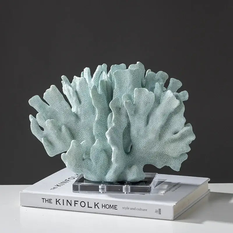 Modern light blue coral resin sculpture with textured matte finish on clear acrylic stand for living room decor