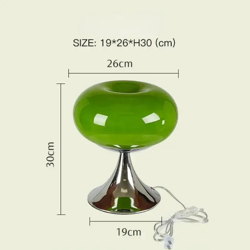 Modern lime green resin stool with vibrant green decorbites glass desk lamp and sleek chrome base for office use