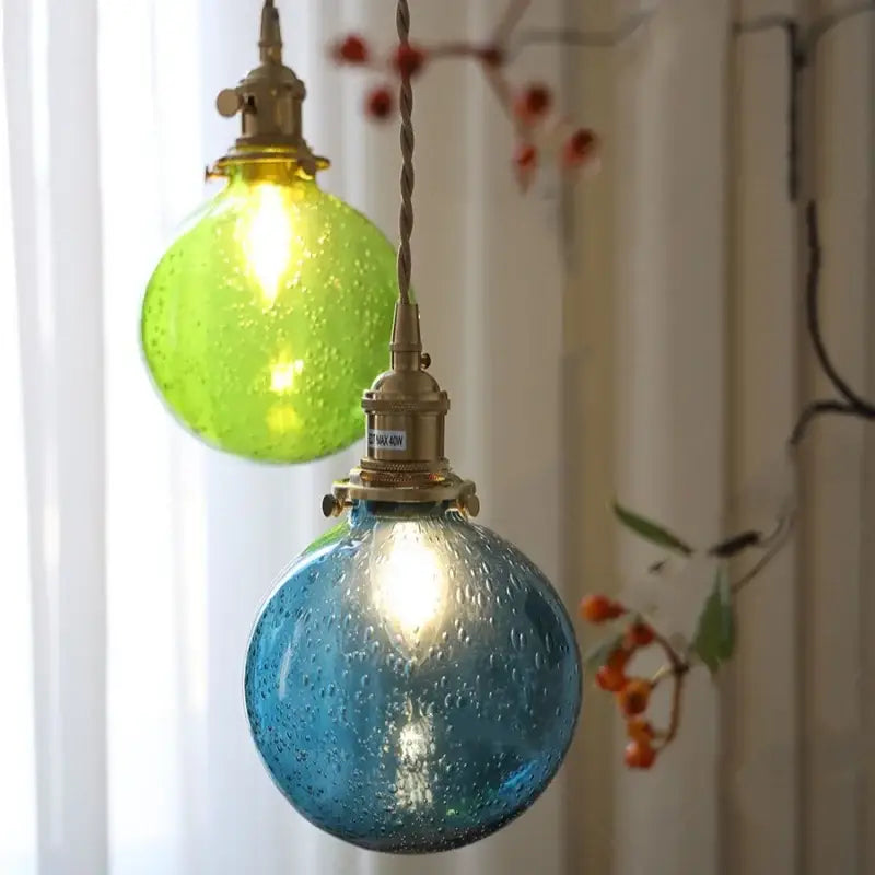 Two spherical modern lime and teal decorbites bubble glass ball pendant lights with twisted metal cords for living room decor