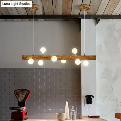 Rustic wooden log pendant light with six warm white globe bulbs modern linear brown metal island lamp by decorbites